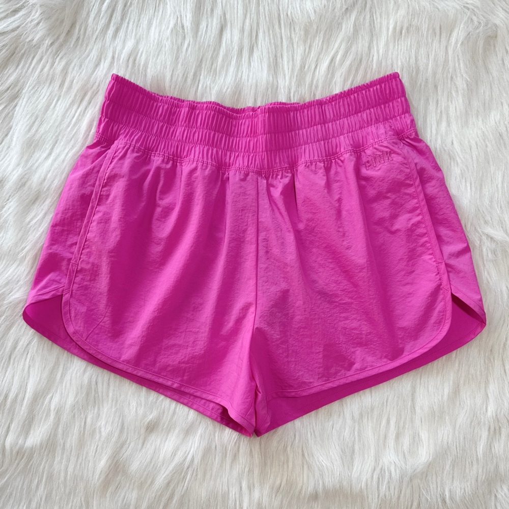 Bright pink athletic running shorts